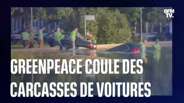 Greenpeace coule des carcasses de voitures devant le salon automobile de Munich en Allemagne