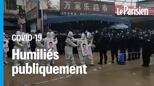 Chine : accusés d’avoir mis en péril les règles anti-Covid, on les force à parader menottés