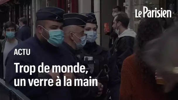 Des centaines de Parisiens un verre à la main, la police intervient