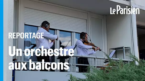 Un orchestre symphonique donne un concert depuis les balcons d’un immeuble de Pontoise