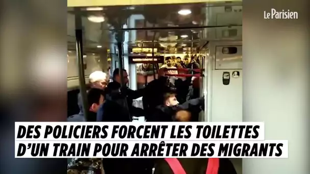 Des policiers forcent les toilettes d&#039;un train pour arrêter des migrants