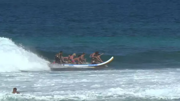 10 guys on a surfboard with Jamie O&#039;Brien